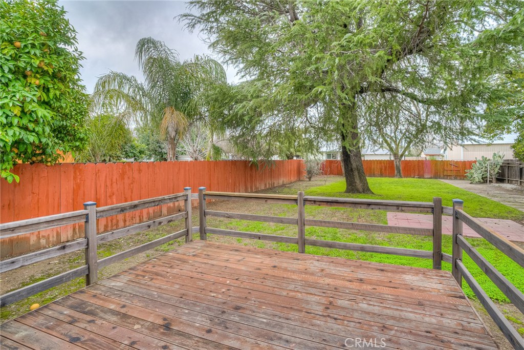 1568 Link Street Corning, CA 96021 - Photo 21 of 28 a green field with trees in the background