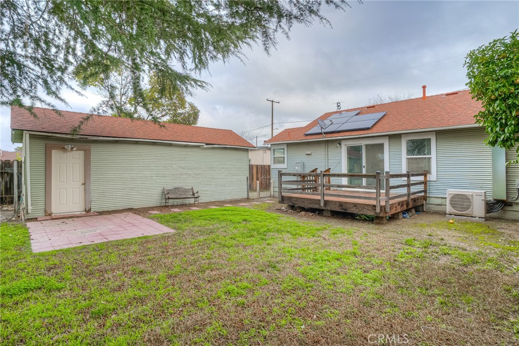 1568 Link Street Corning, CA 96021 - Photo 26 of 28 a backyard of a house with yard table and chairs