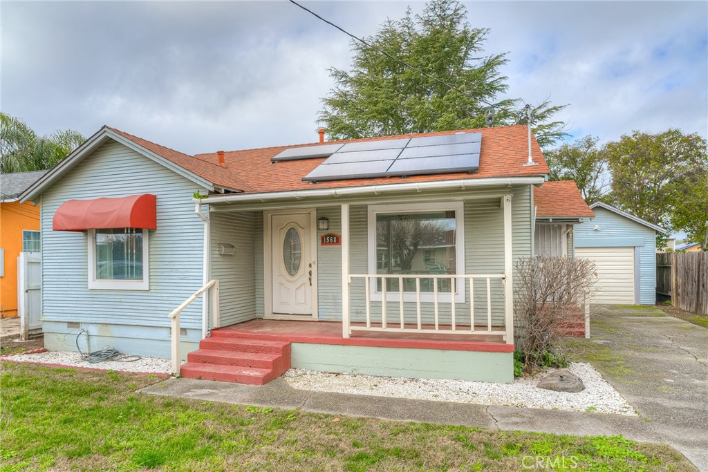 1568 Link Street Corning, CA 96021 - Photo 28 of 28 a front view of a house with a garden and yard