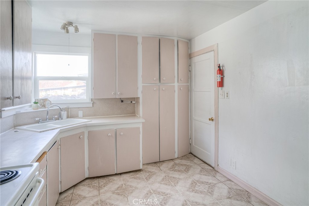 1568 Link Street Corning, CA 96021 - Photo 9 of 28 a view of a kitchen with cabinets