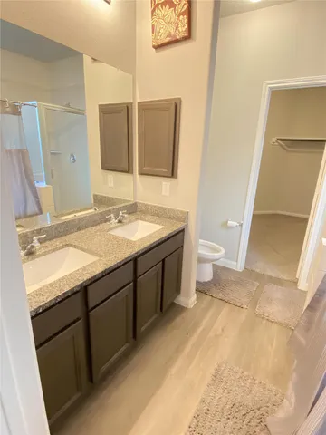 a bathroom with a bath tub and shower