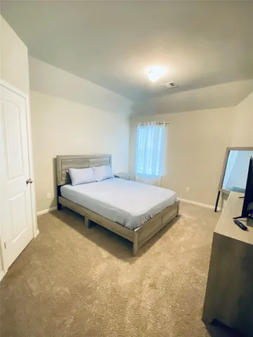 a bathroom with a sink a mirror and a vanity