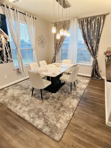 a room with a table and chairs