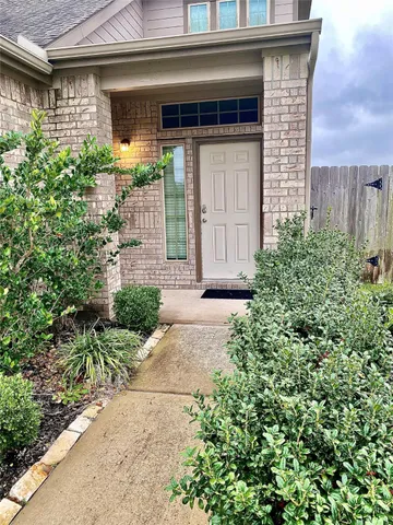 a view of a room with wooden floor and cabinet