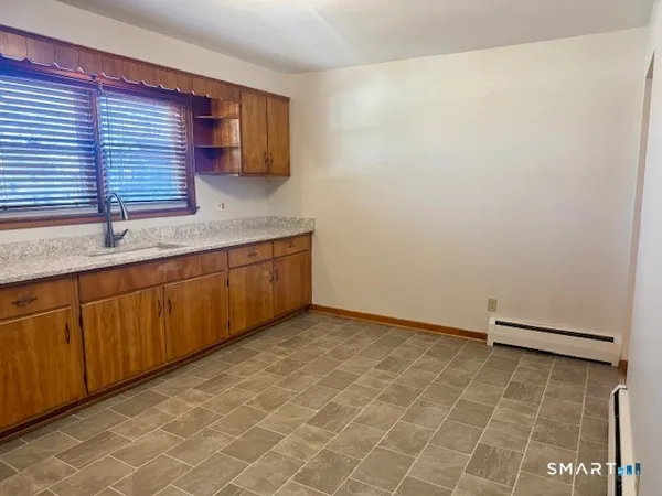 a kitchen with a sink and cabinets