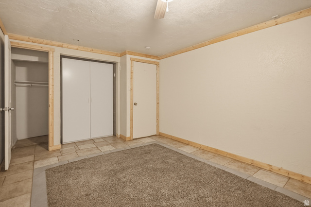 337 North Main Street Central Valley, UT 84754 - Photo 31 of 40 Unfurnished bedroom with a textured ceiling and a ceiling fan