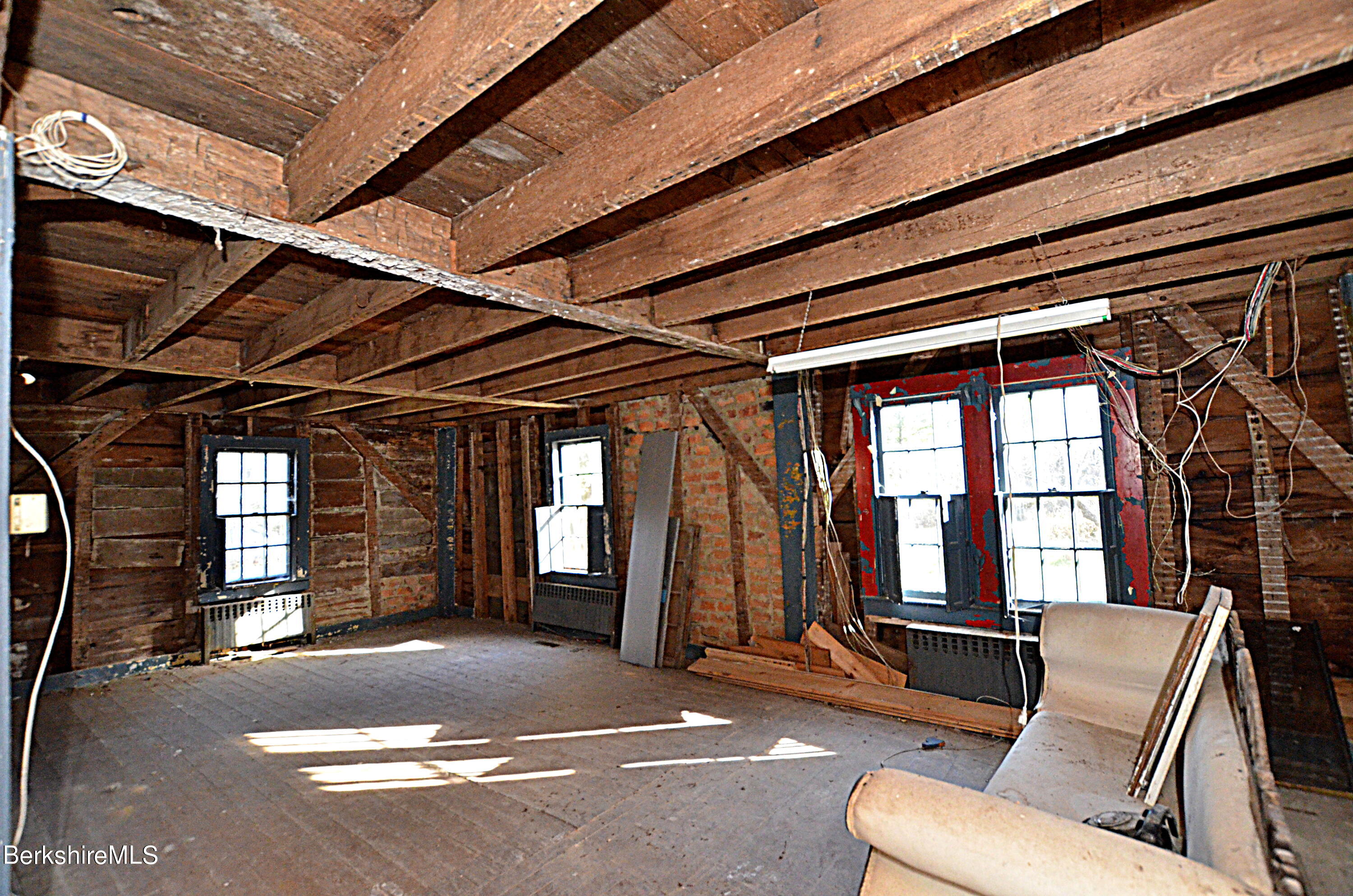 178 New Hartford Road Sandisfield, MA 01255 - Photo 11 of 62 a view of a porch with furniture and a garage