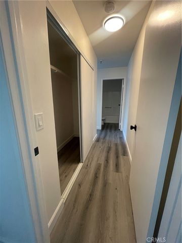 a bathroom with a sink a toilet a mirror and shower