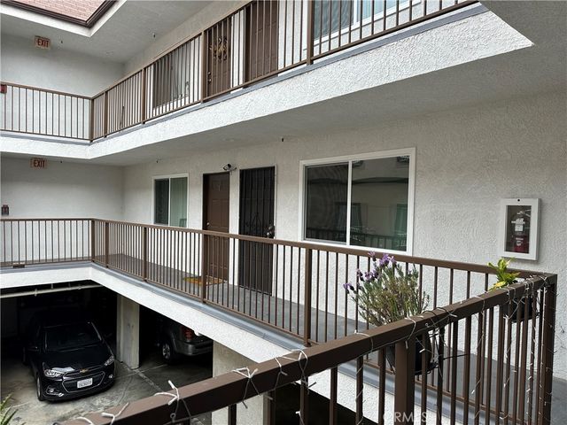a view of a livingroom with furniture and staircase