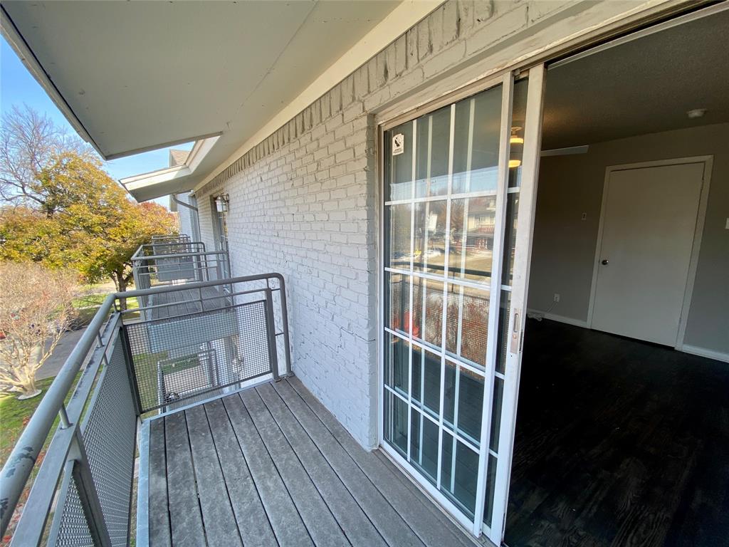 4502 Gaston Avenue, Unit 322 Dallas, TX 75246 - Photo 17 of 17 a view of a balcony with wooden floor