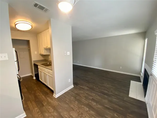 a view of kitchen and wooden floor