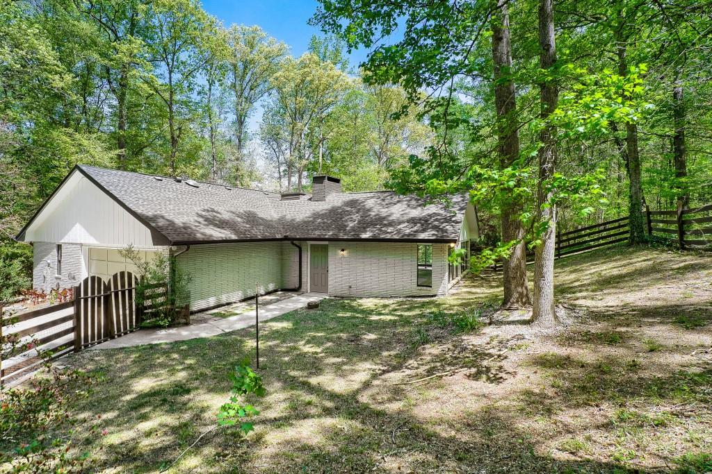 2021 Irwin Bridge Road Northwest Conyers, GA 30012 - Photo 39 of 43 a backyard of a house with table and chairs