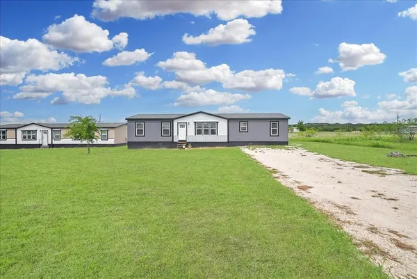 a view of a house with a big yard