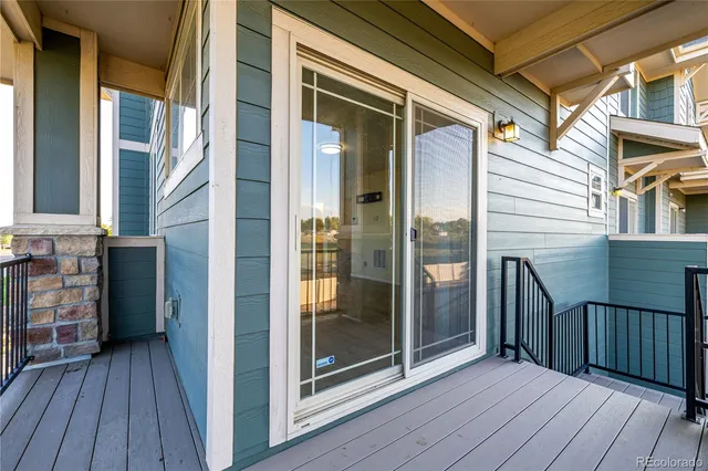 a view of a balcony with wooden floor