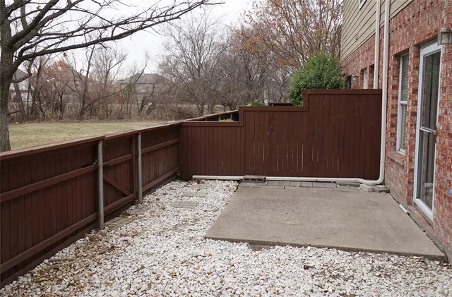 a view of a backyard of the house