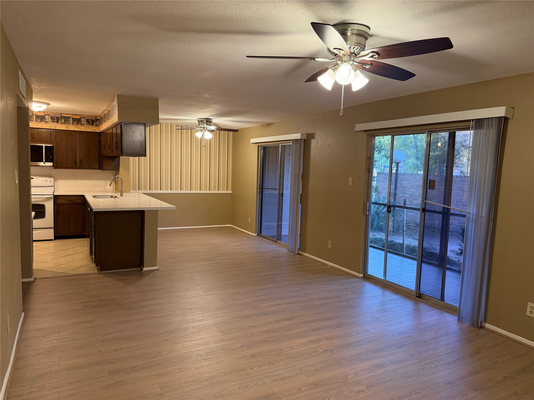 14515 Wunderlich Drive, Unit 703 Houston, TX 77069 - Photo 21 of 25 a view of a kitchen with furniture and a ceiling fan