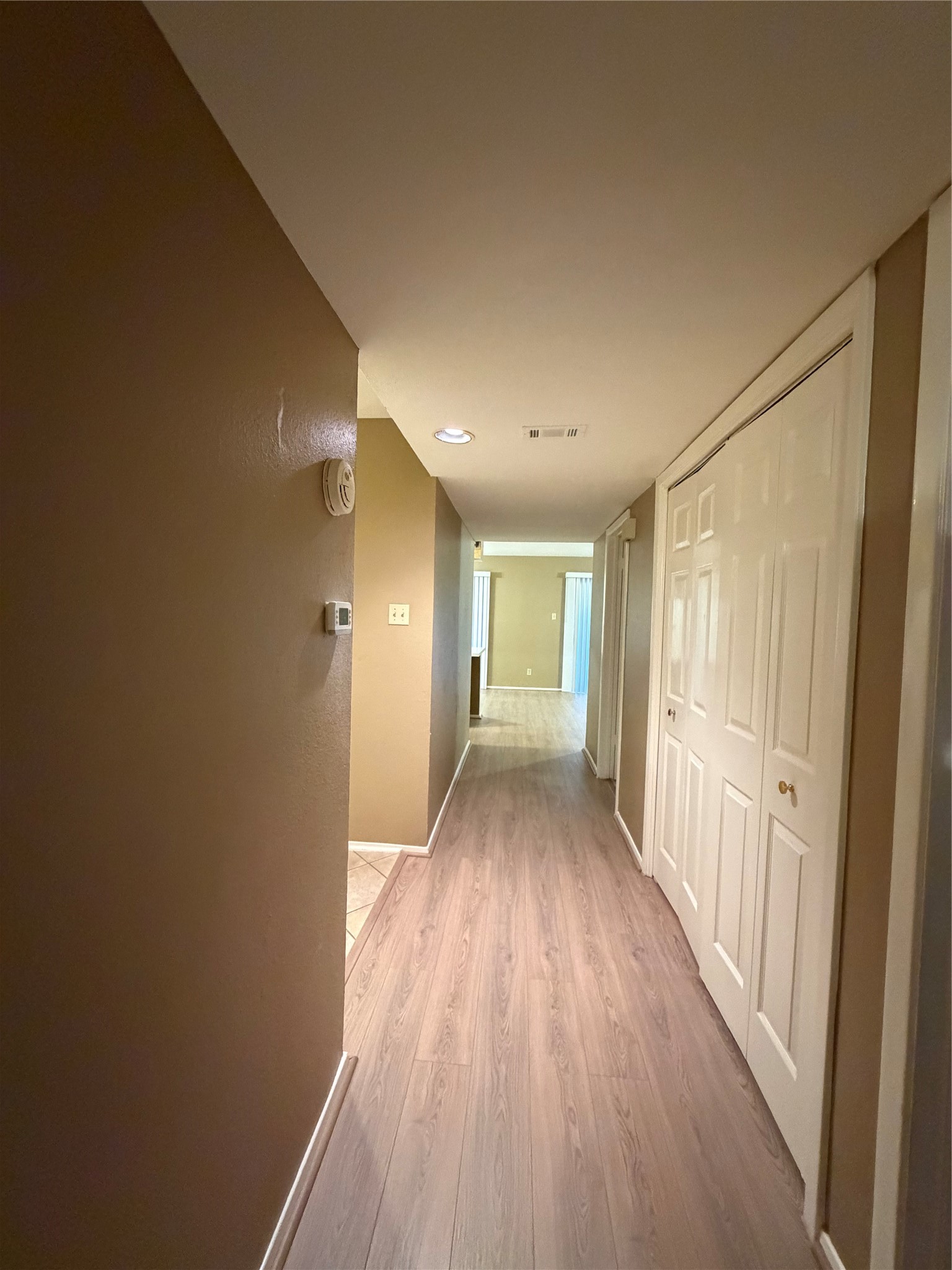 14515 Wunderlich Drive, Unit 703 Houston, TX 77069 - Photo 25 of 25 a view of a hallway with wooden floor