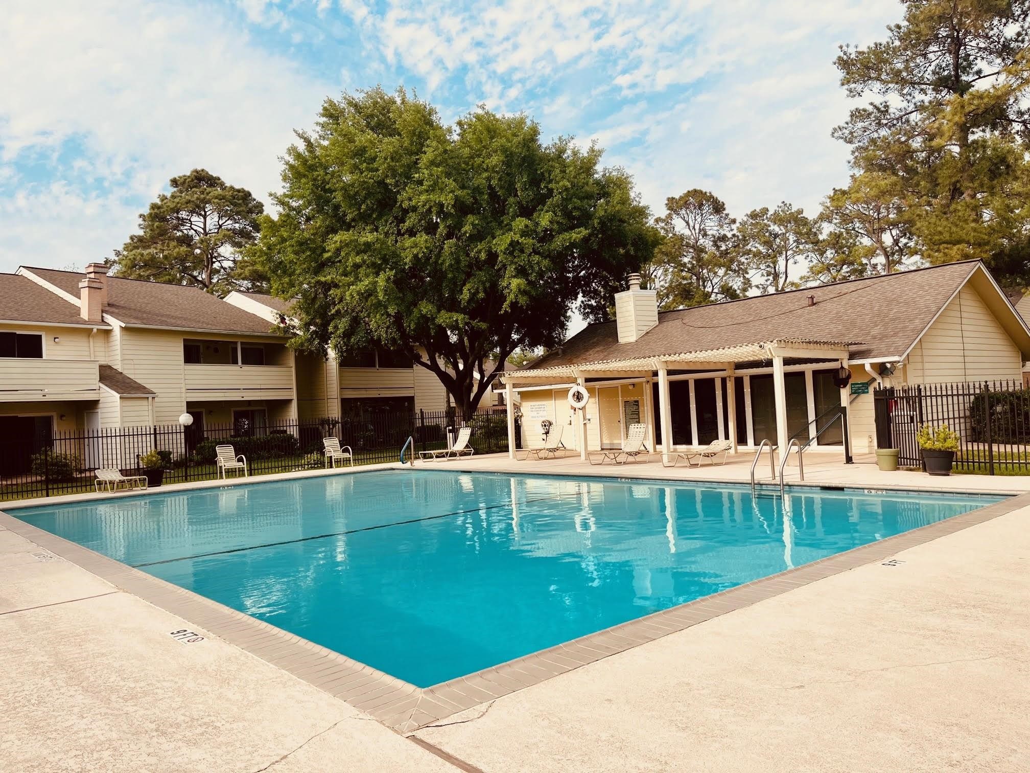 14515 Wunderlich Drive, Unit 703 Houston, TX 77069 - Photo 3 of 25 a front view of house with yard and green space