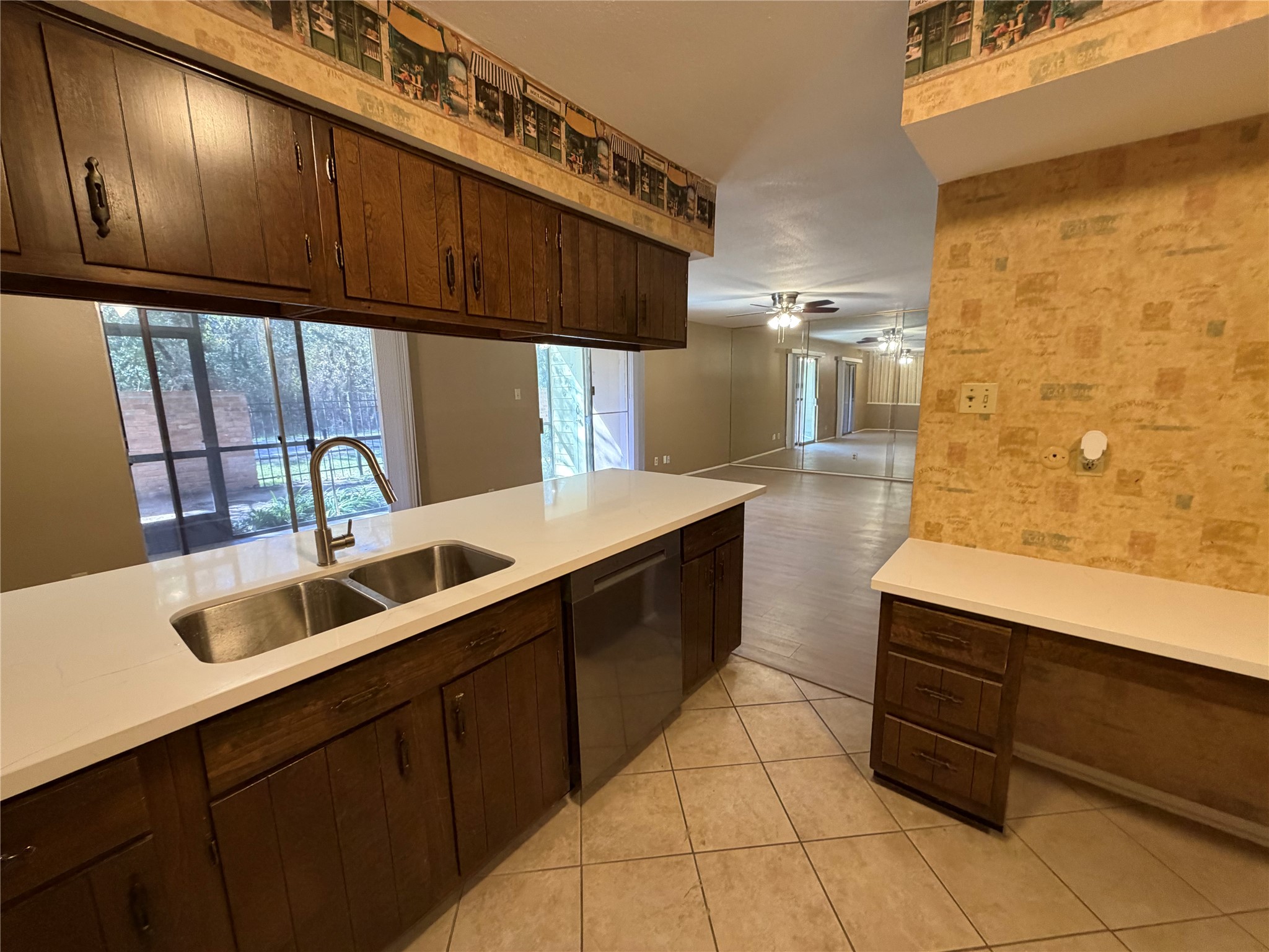 14515 Wunderlich Drive, Unit 703 Houston, TX 77069 - Photo 7 of 25 a kitchen with a sink and cabinets