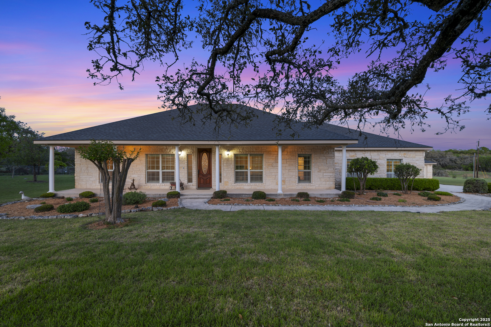 27512 Autumn Glen Boerne, TX 78006 - Photo 1 of 1 a front view of a house with patio and garden