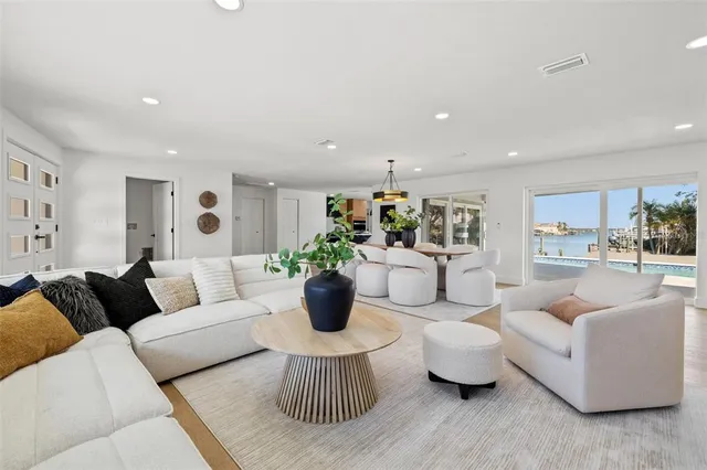 a kitchen with stainless steel appliances a sink a counter space and a refrigerator