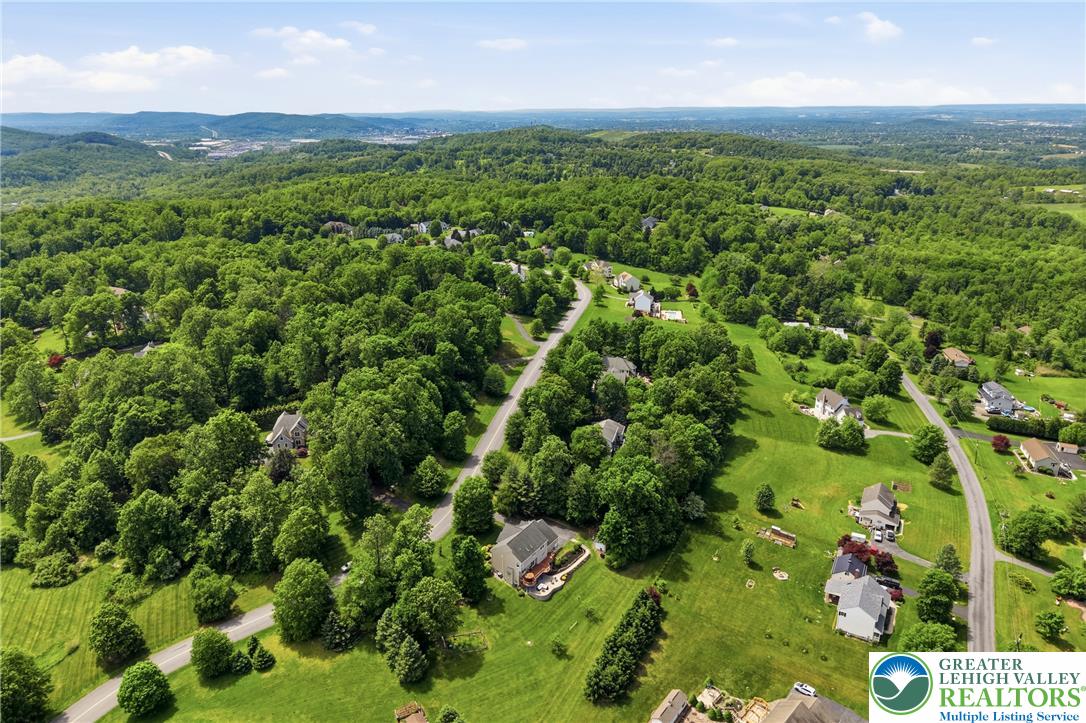 115 West Butternut Road Hellertown, PA 18055 - Photo 87 of 97 An aerial panorama reveals a picturesque neighborhood nestled within a verdant, rolling landscape.