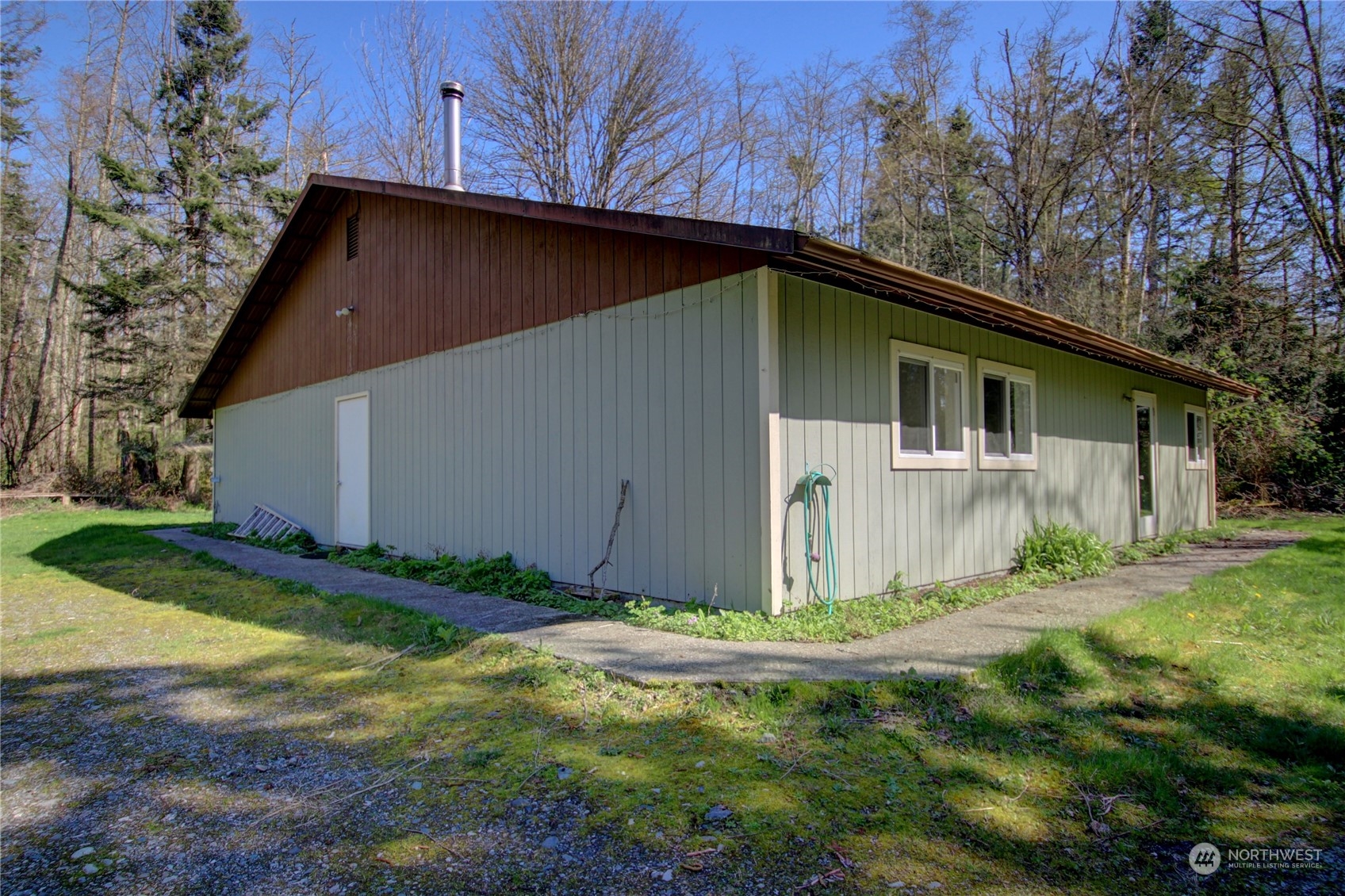 13709 Rector Road Bow, WA 98232 - Photo 29 of 36 a backyard of a house with plants and large tree