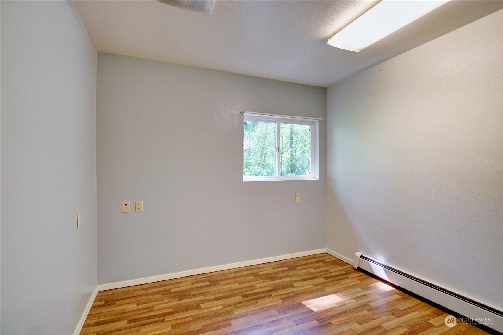 13709 Rector Road Bow, WA 98232 - Photo 32 of 36 a view of an empty room with wooden floor and a window