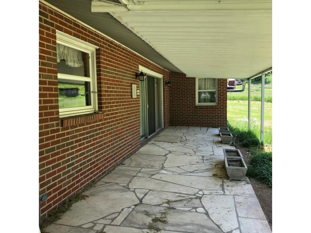 488 Lowell Stalcup Road Butler, TN 37640 - Photo 6 of 34 BACK COVERED PORCH