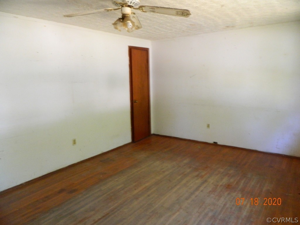 125 Sylvan Road Wakefield, VA 23888 - Photo 5 of 14 Living Room with hardwood floors
