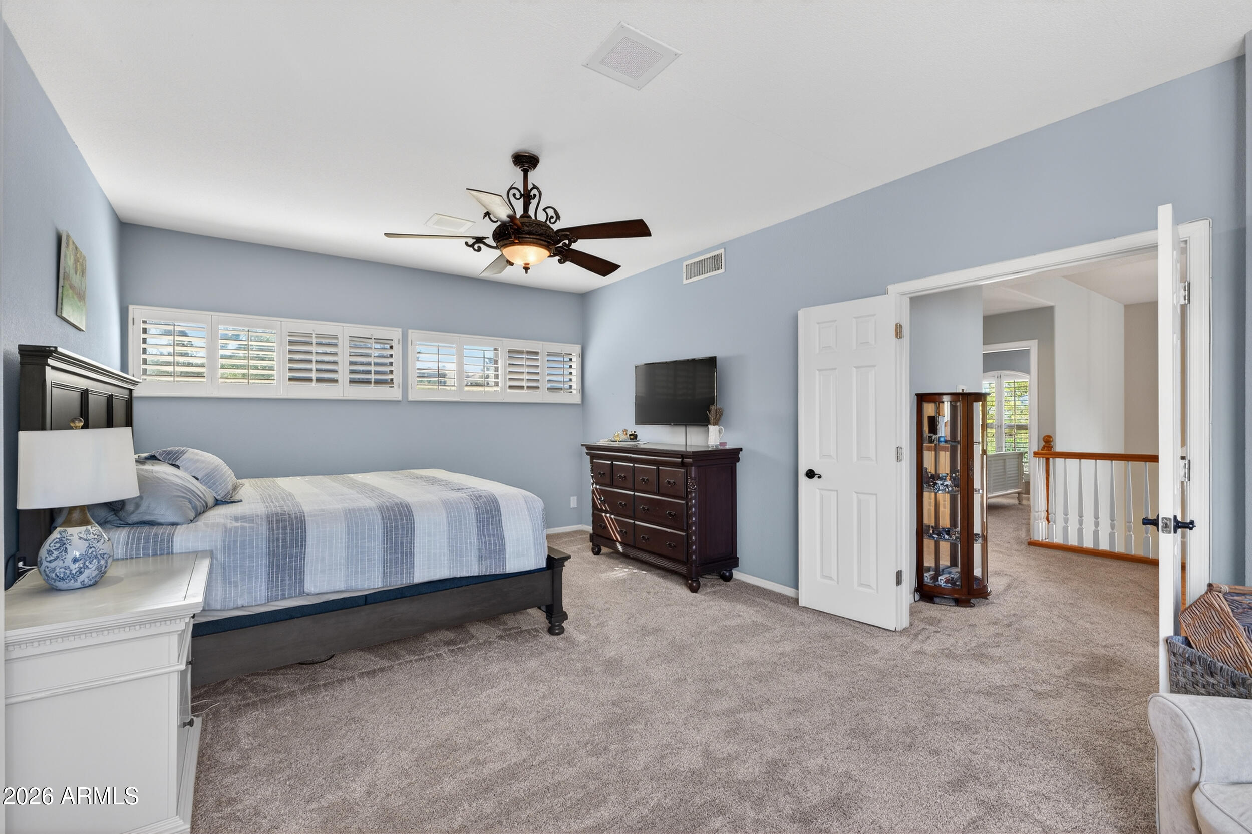 1539 East Winged Foot Road Phoenix, AZ 85022 - Photo 32 of 64 a bedroom with a bed and a flat screen tv