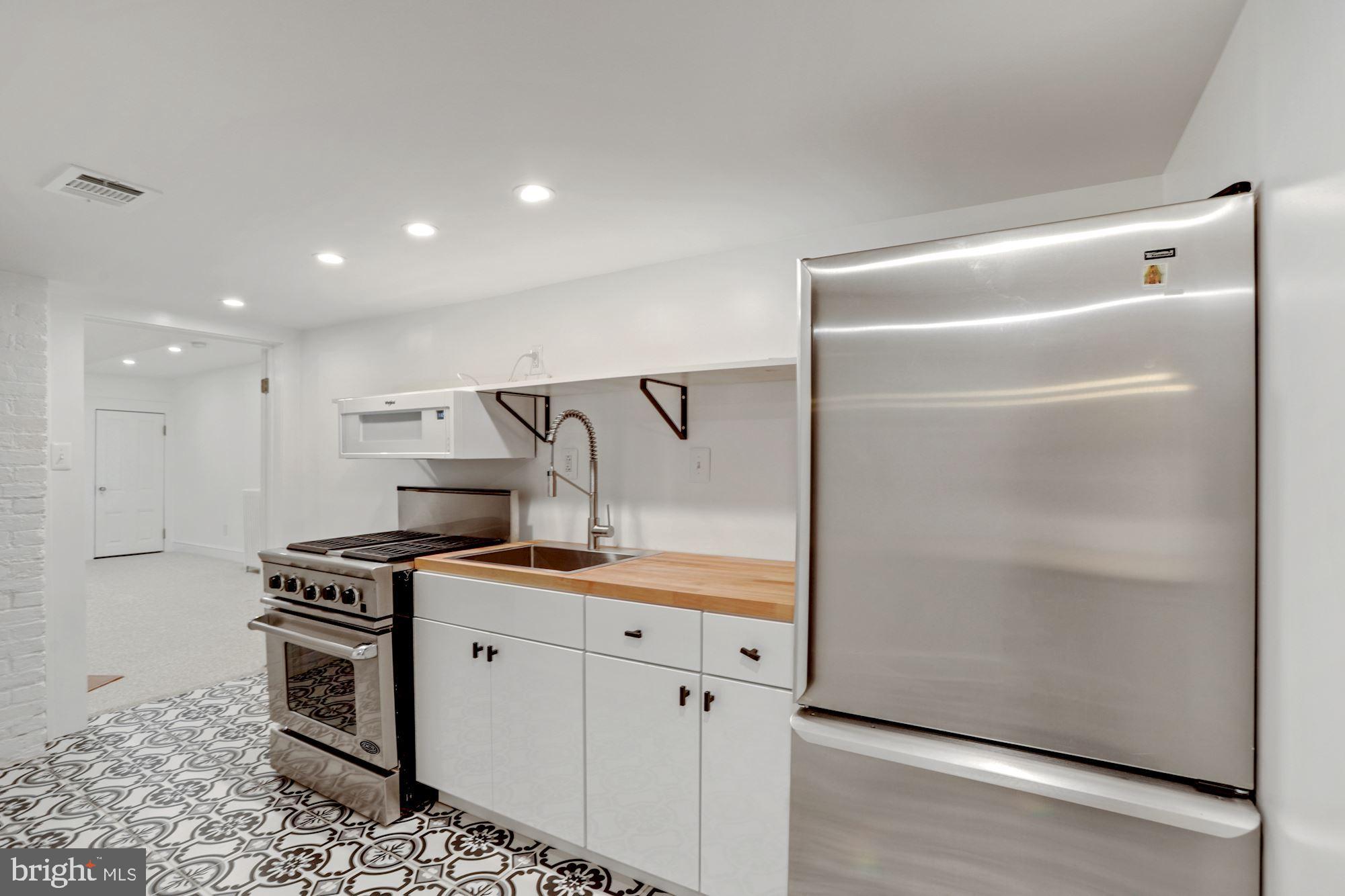 607 Q Street Northwest Washington, DC 20001 - Photo 41 of 74 Kitchen with Stainless Appliances