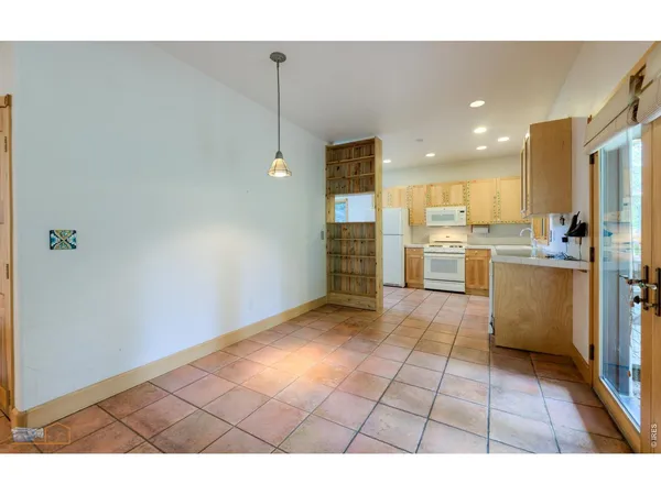 a kitchen with a refrigerator a sink and a stove
