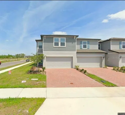 a house view with swimming pool in front of it