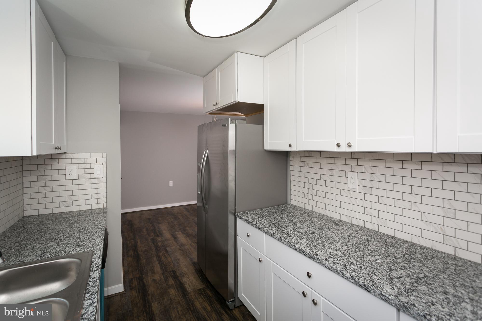 6227 Catalpha Road Baltimore, MD 21214 - Photo 9 of 22 Custom Tile Backsplash & New SS Fridge