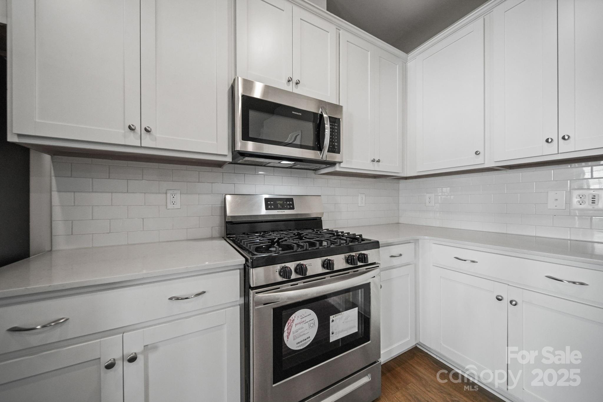 808 Gable Oak Lane Fort Mill, SC 29708 - Photo 12 of 41 a kitchen with white cabinets and appliances