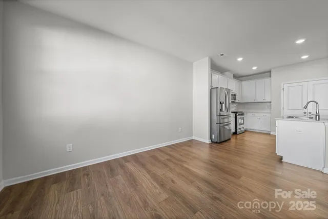 a view of kitchen with wooden floor