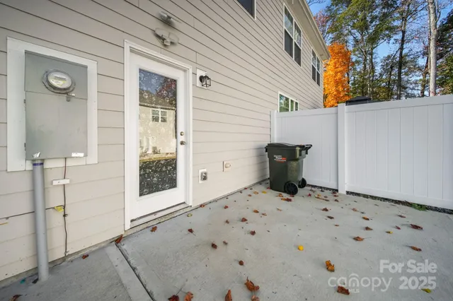 a view of a wooden door and a chair