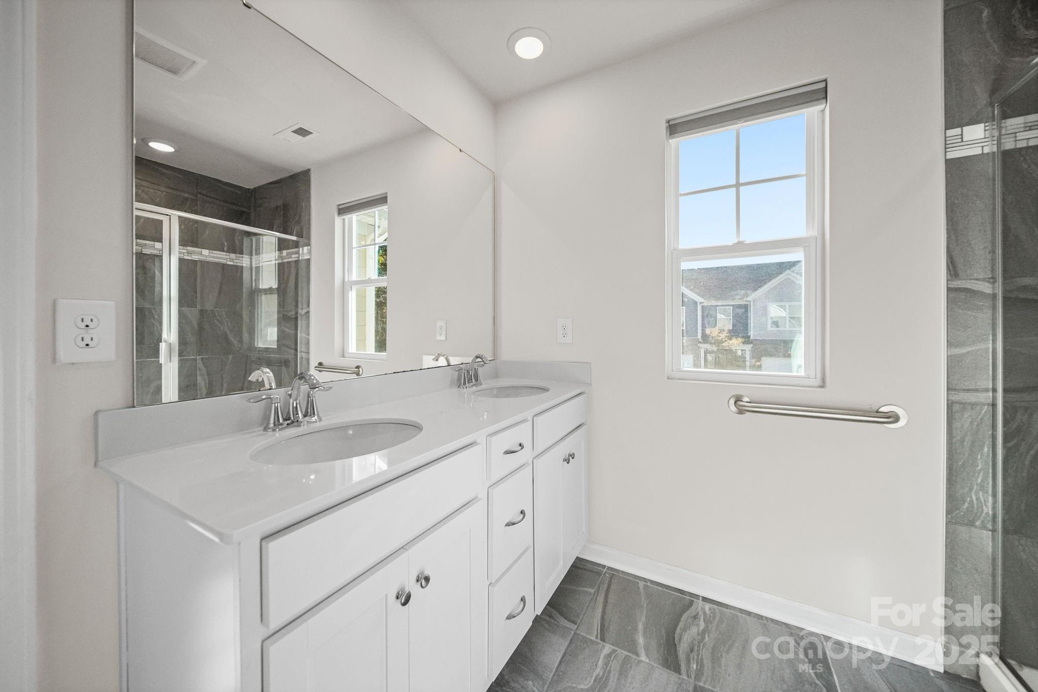 808 Gable Oak Lane Fort Mill, SC 29708 - Photo 31 of 41 a bathroom with a sink and a mirror