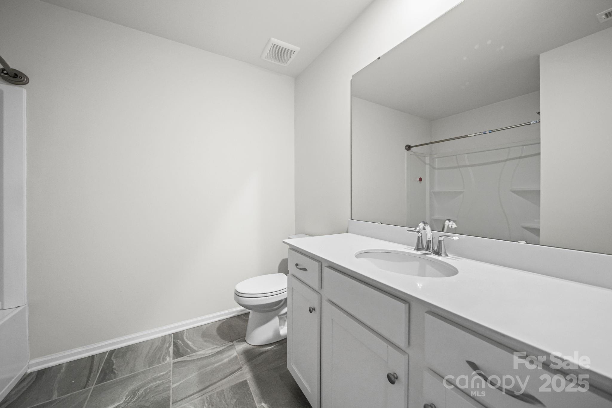 808 Gable Oak Lane Fort Mill, SC 29708 - Photo 34 of 41 a bathroom with a granite countertop sink mirror vanity and toilet