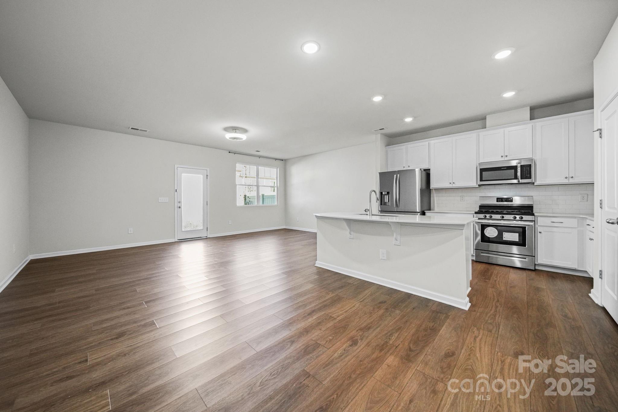 808 Gable Oak Lane Fort Mill, SC 29708 - Photo 4 of 41 a view of kitchen with microwave and cabinets
