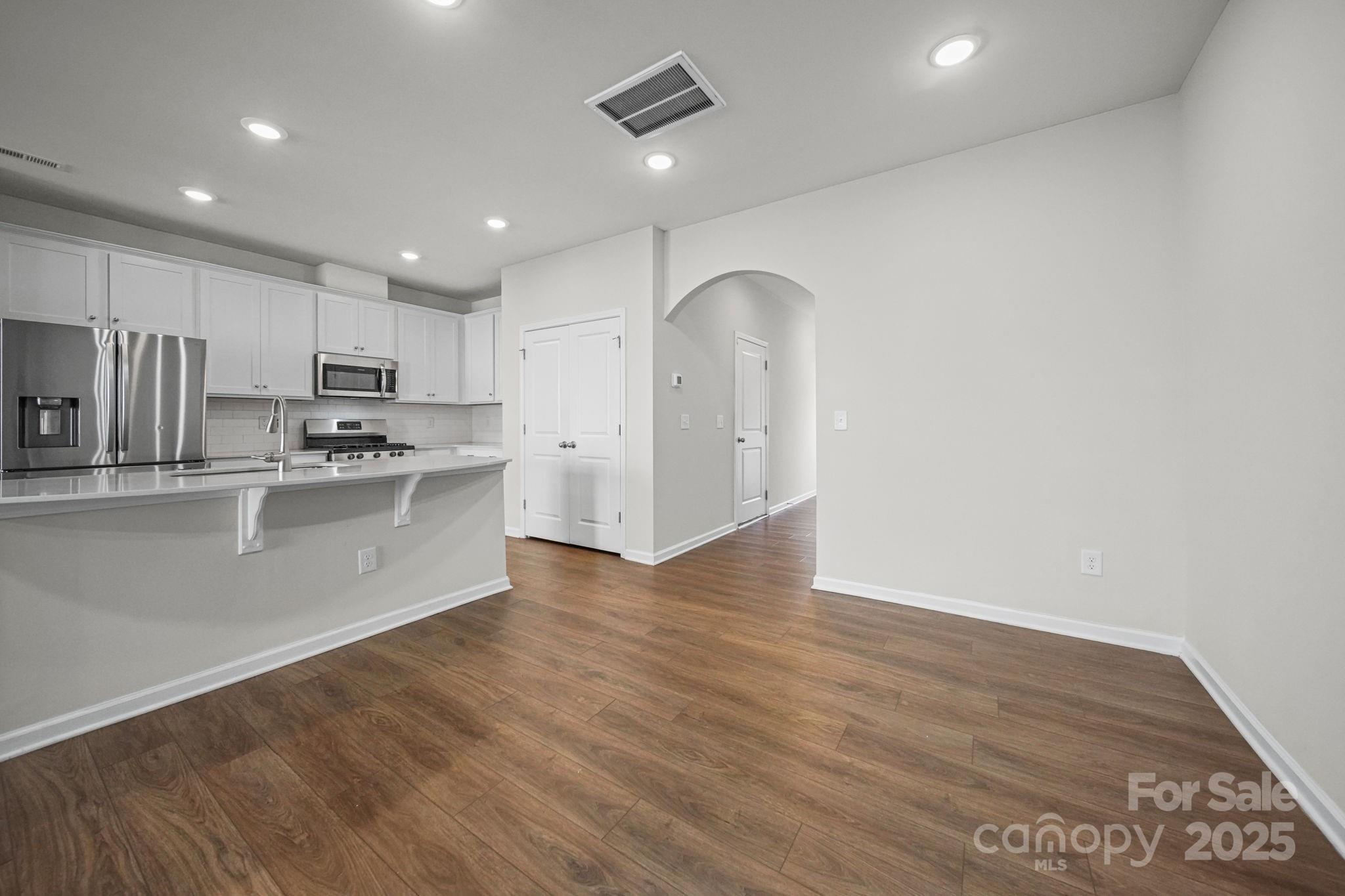 808 Gable Oak Lane Fort Mill, SC 29708 - Photo 5 of 41 a kitchen with stainless steel appliances granite countertop a refrigerator a sink dishwasher and a oven with white cabinets