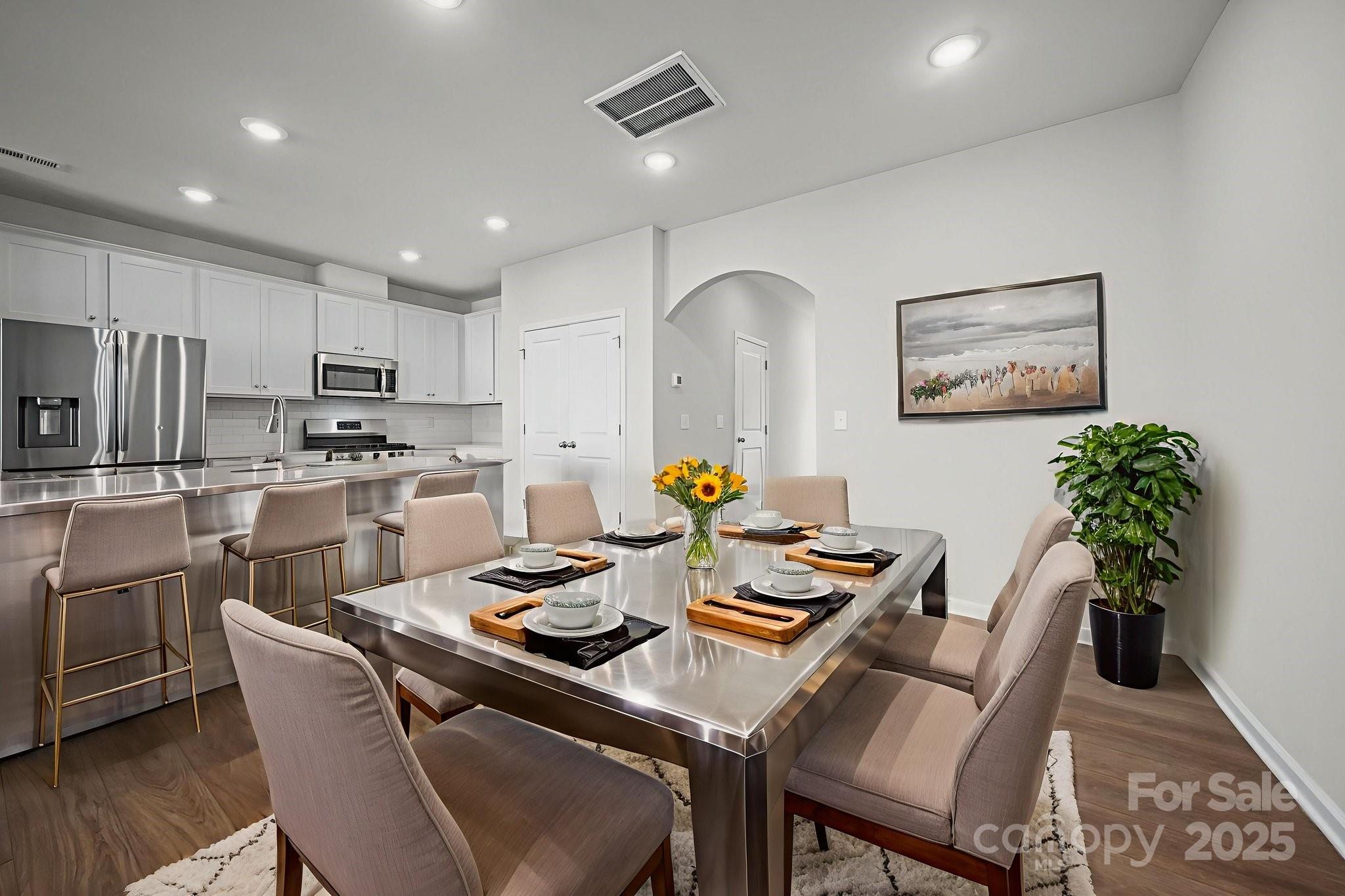 808 Gable Oak Lane Fort Mill, SC 29708 - Photo 6 of 41 a living room with stainless steel appliances kitchen island granite countertop furniture and a dining table