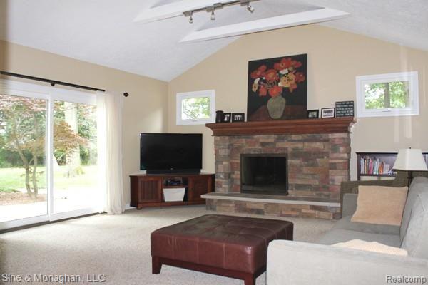 2965 Leyton Court Rochester, MI 48306 - Photo 15 of 29 Beautiful family room with stone fireplace and 2nd doorwall to patio