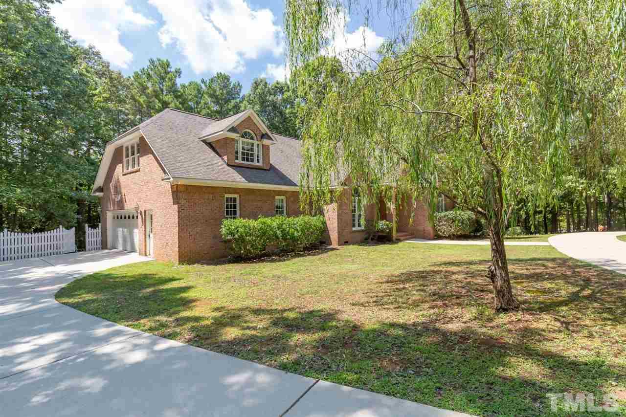 12613 Raven Ridge Road Raleigh, NC 27614 - Photo 3 of 29 a front view of a house with a yard