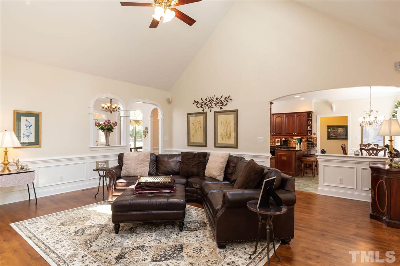 12613 Raven Ridge Road Raleigh, NC 27614 - Photo 8 of 29 a living room with furniture and a wooden floor
