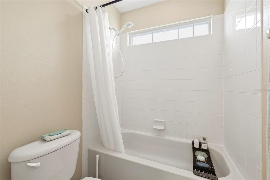 936 Kingsridge Circle Gotha, FL 34734 - Photo 44 of 50 a bathroom with a shower a toilet and a sink