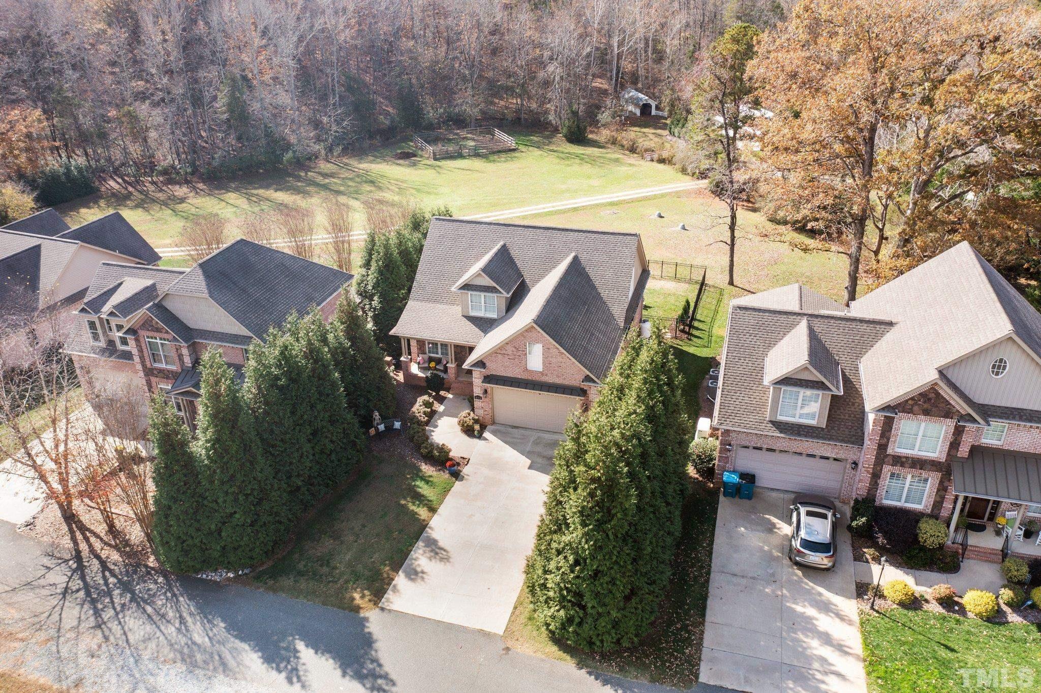 213 Serendipity Drive Haw River, NC 27258 - Photo 11 of 33 an aerial view of a house with a swimming pool and garden view