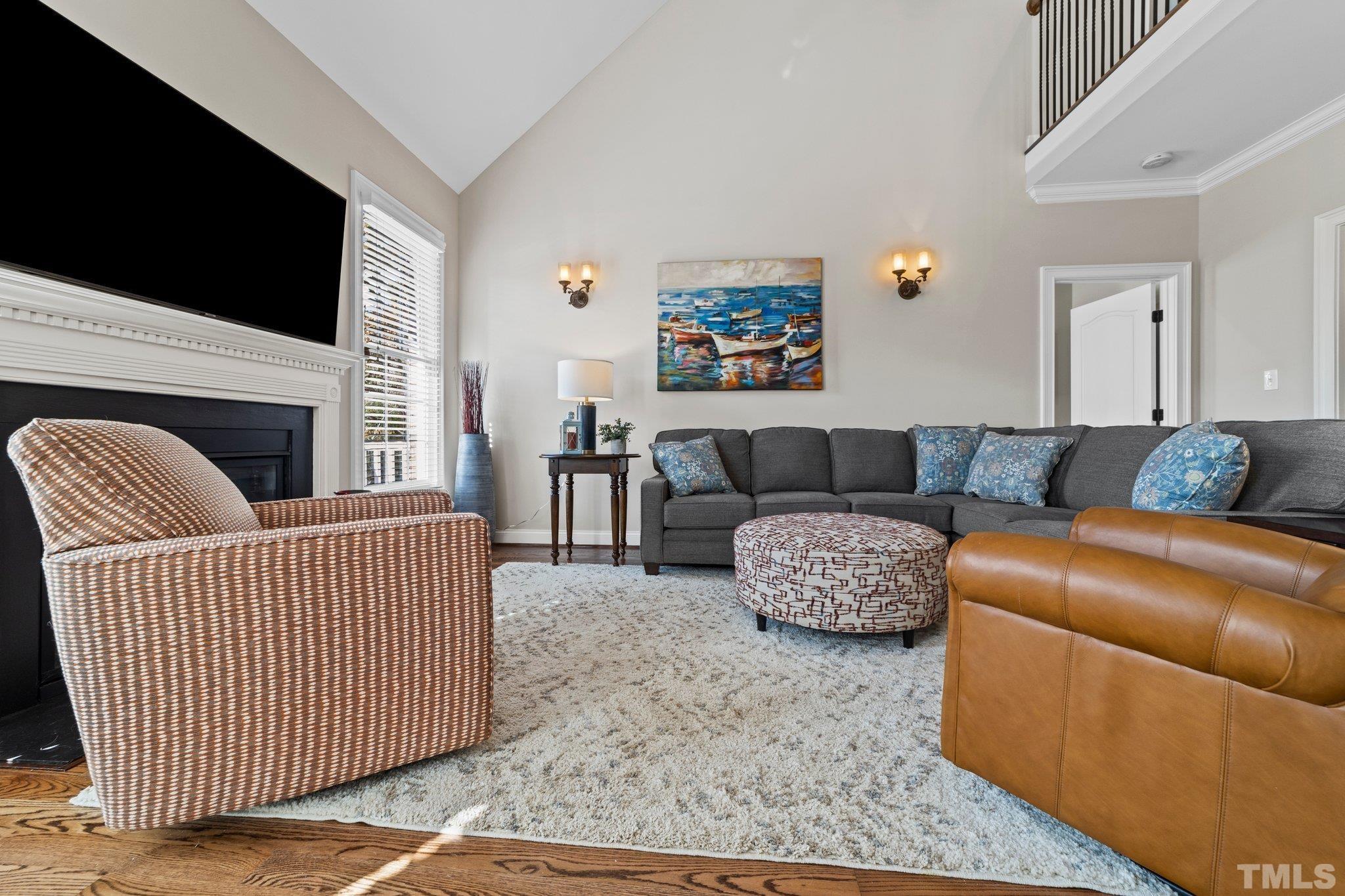 213 Serendipity Drive Haw River, NC 27258 - Photo 17 of 33 a living room with furniture and a flat screen tv