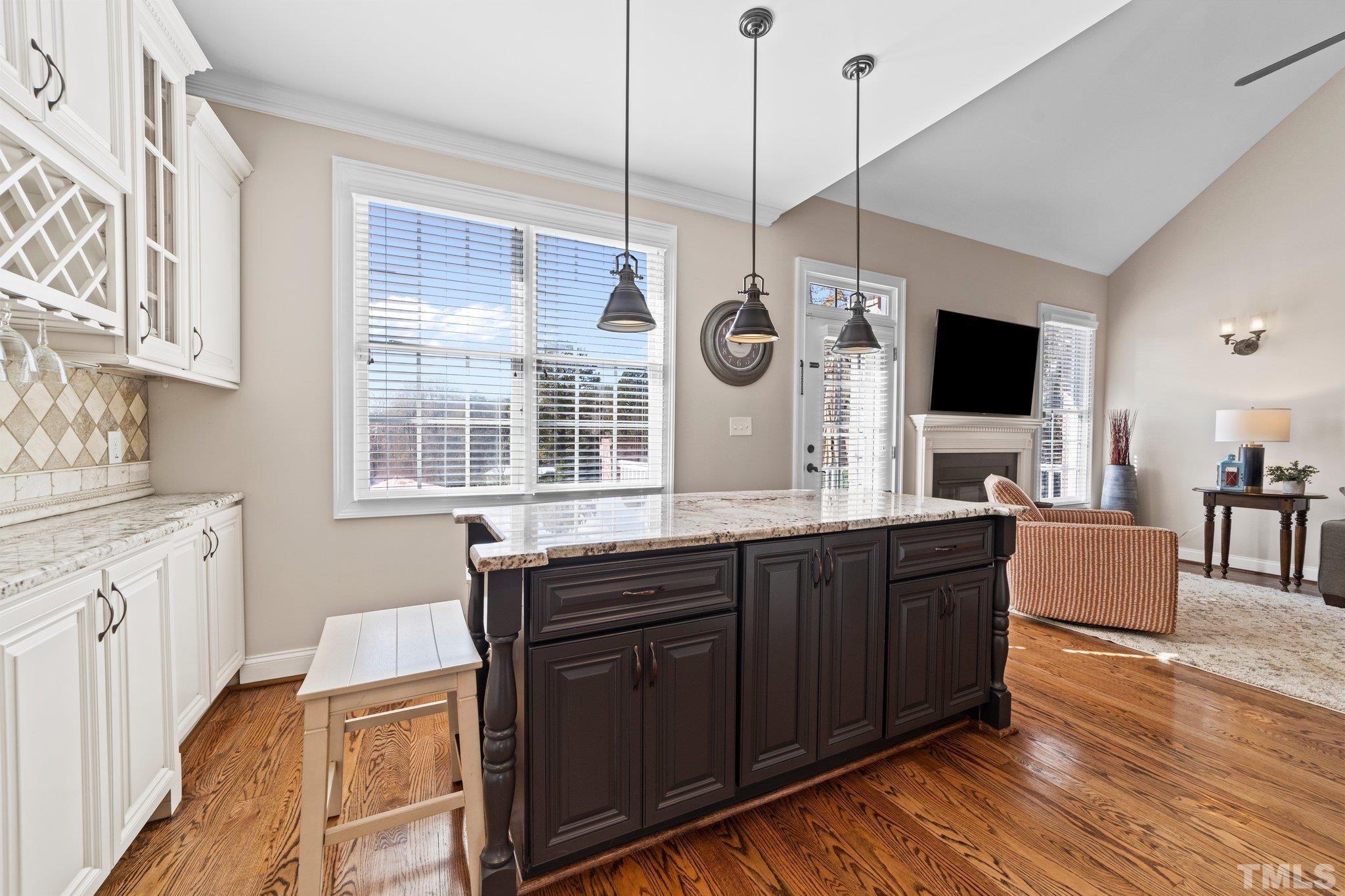 213 Serendipity Drive Haw River, NC 27258 - Photo 19 of 33 a open kitchen with stainless steel appliances granite countertop a stove a sink and a wooden floors